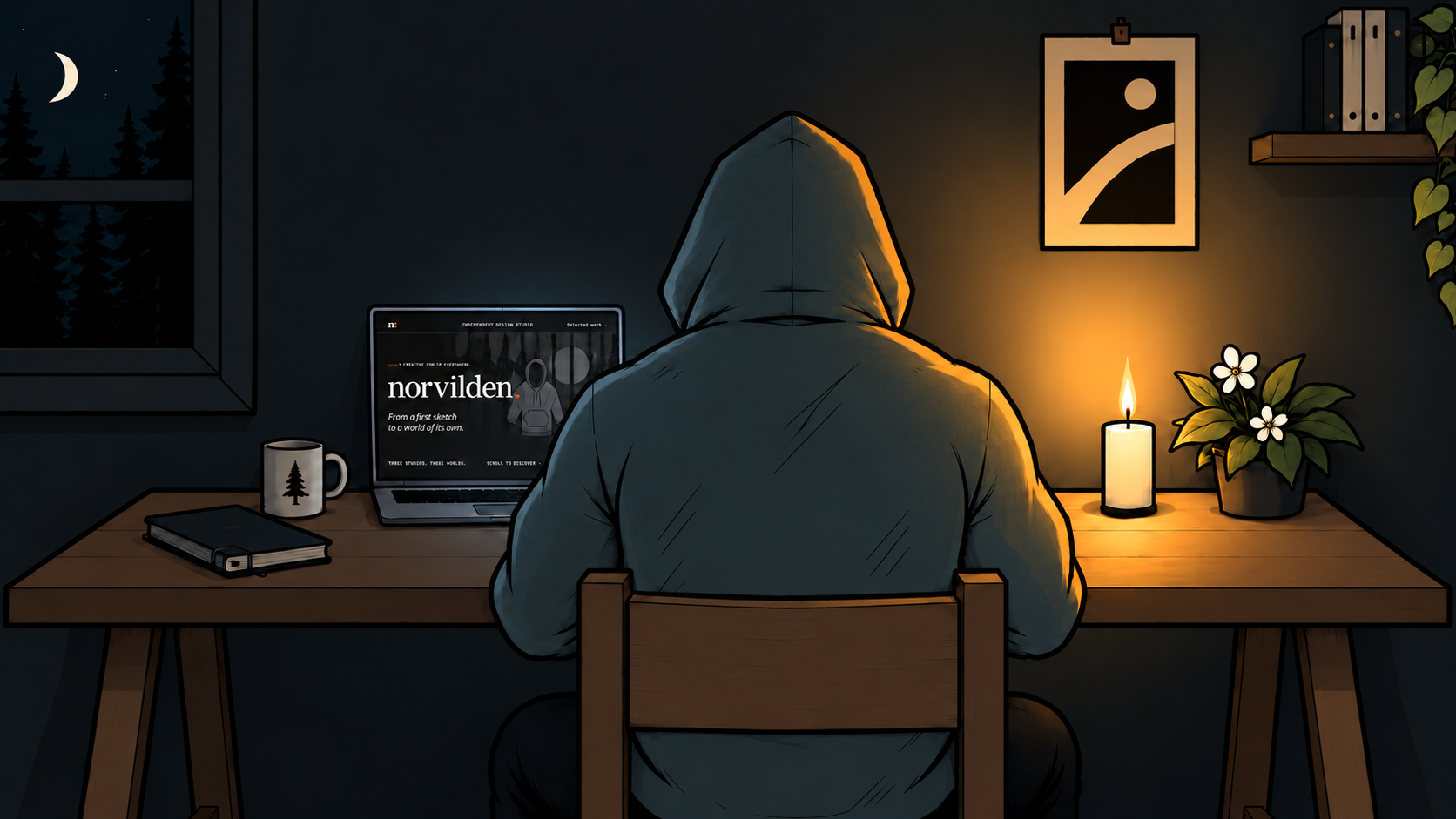 An illustrator at a desk, looking at the Norvilden portfolio on a laptop